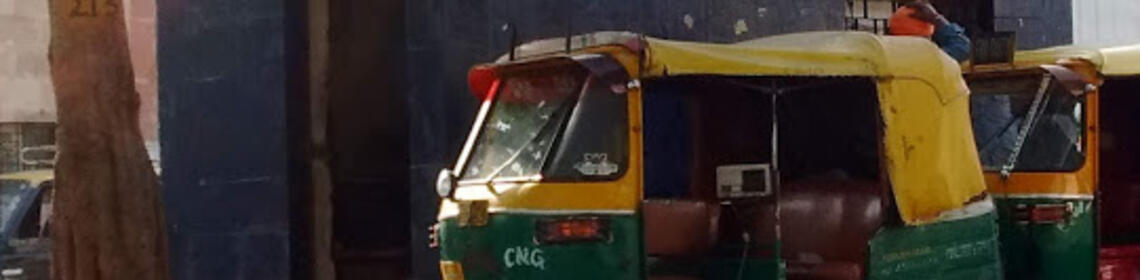 A police managed, pre-paid autorickshaw stand at a major railway station in Delhi, India. [Photo-credit: William Stafford]